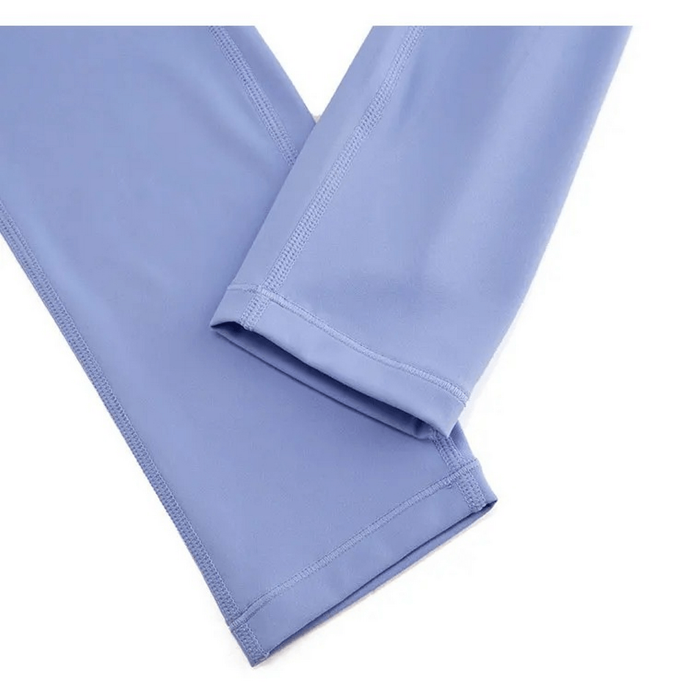 Close-up of light blue stylish yoga and gym stretch leggings, crafted from a comfy nylon-spandex blend with robust elastic waistband for women.